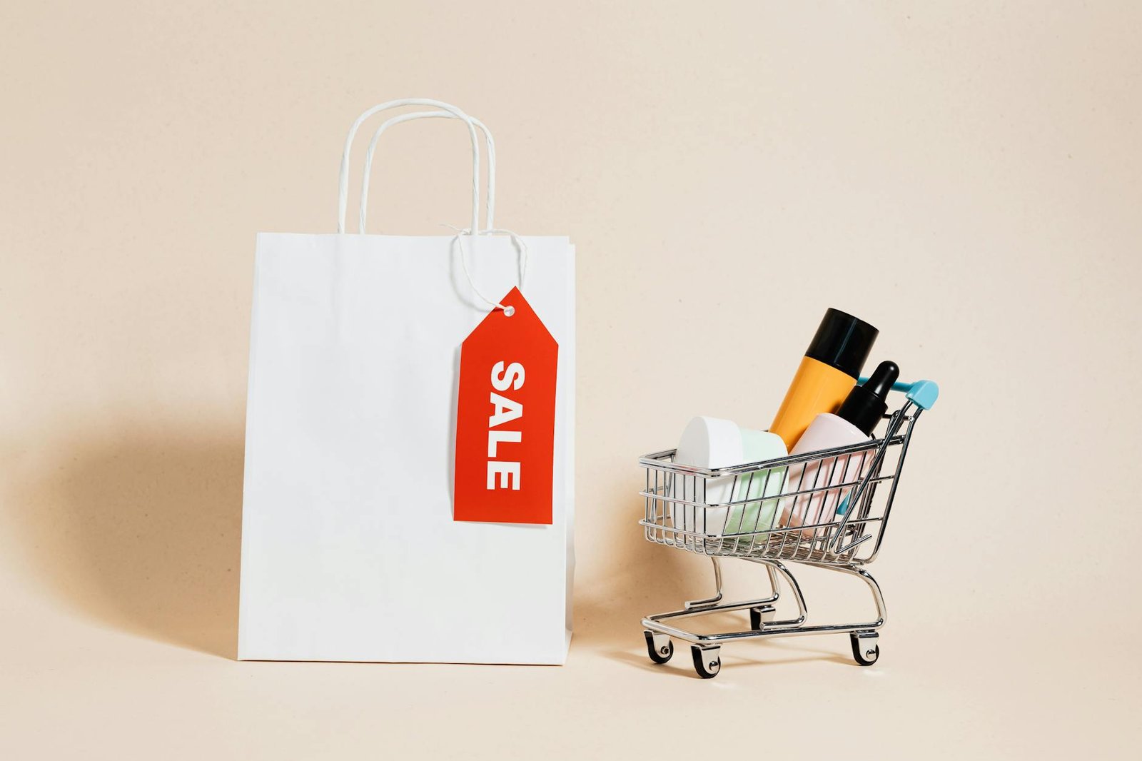 passive income a white paper bag and shopping cart on beige background